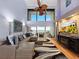 Comfortable living room with ocean views, floor-to-ceiling windows and sleek furnishings at 19700 Gulf Blvd # 204, Indian Shores, FL 33785