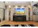 Comfortable living room with wood floors and a large entertainment center with display shelving at 19700 Gulf Blvd # 204, Indian Shores, FL 33785