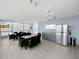 Spacious lounge featuring large windows, modern furniture, and a well-equipped kitchenette at 19700 Gulf Blvd # 204, Indian Shores, FL 33785