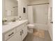 Bright bathroom featuring a shower-tub combination, ample countertop space, and neutral finishes at 2913 Suncoast Plains Dr, Odessa, FL 33556