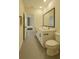 Well-lit bathroom featuring a double vanity, sleek fixtures, and a neutral color palette at 2913 Suncoast Plains Dr, Odessa, FL 33556