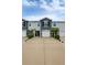 Well maintained townhome with manicured landscaping, a large driveway, and a neutral color scheme at 2913 Suncoast Plains Dr, Odessa, FL 33556