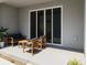 Modern patio with comfortable seating area, ideal for relaxation and entertaining at 2913 Suncoast Plains Dr, Odessa, FL 33556