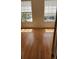 Bright bedroom with wood floor, natural lighting and a view of outside at 6600 121St Ave # 5, Largo, FL 33773