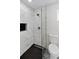 Bathroom showcasing a modern shower with glass doors, black fixtures, and stylish tile work at 1849 New Hampshire Ne Ave, St Petersburg, FL 33703