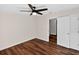 Bedroom with hardwood flooring, ceiling fan, and ample closet space at 1849 New Hampshire Ne Ave, St Petersburg, FL 33703