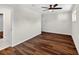 Bright bedroom with a ceiling fan, wood-look flooring, and a neutral color palette with natural light at 1849 New Hampshire Ne Ave, St Petersburg, FL 33703