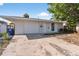 Updated single Gathering home featuring a one car garage, double entry doors and manicured landscaping at 1849 New Hampshire Ne Ave, St Petersburg, FL 33703
