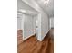 Hallway features hardwood floors, fresh paint, and new lighting at 1849 New Hampshire Ne Ave, St Petersburg, FL 33703