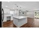 Updated kitchen with pendant lighting, an island with quartz countertops, and stainless appliances at 1849 New Hampshire Ne Ave, St Petersburg, FL 33703
