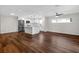 Open concept living area, featuring hardwood floors, a ceiling fan, and an updated kitchen at 1849 New Hampshire Ne Ave, St Petersburg, FL 33703
