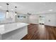 Living room with modern lighting, new windows, an open floor plan, and sliding glass doors to the backyard at 1849 New Hampshire Ne Ave, St Petersburg, FL 33703