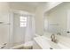 Clean and modern bathroom features a walk-in shower, white vanity, and chrome fixtures at 221 Vermont E Ave, Bradenton, FL 34208