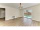 Dining room with light wood floors and sliding glass doors that overlook the pool at 221 Vermont E Ave, Bradenton, FL 34208