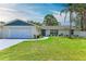 Charming single-story home featuring a well-manicured lawn and a cozy, inviting exterior with attached garage at 221 Vermont E Ave, Bradenton, FL 34208