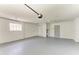 Spacious garage with concrete floor and multiple doors at 221 Vermont E Ave, Bradenton, FL 34208
