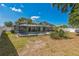 Expansive backyard with a screened in pool, a spa, and ample outdoor living space at 2521 Carlisle Pl, Sarasota, FL 34231