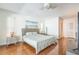Bright bedroom with hardwood floors, a large bed, and modern decor at 2521 Carlisle Pl, Sarasota, FL 34231