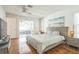 Cozy bedroom with hardwood floors and a view of the outdoor seating area at 2521 Carlisle Pl, Sarasota, FL 34231