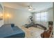 Well-lit bedroom featuring exercise equipment, a sofa, and tile floors at 2521 Carlisle Pl, Sarasota, FL 34231
