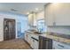 Kitchen features granite countertops, stainless steel appliances, modern cabinets, and tile floors at 2521 Carlisle Pl, Sarasota, FL 34231