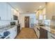 This updated kitchen features granite countertops, white subway tile backsplash, and stainless steel appliances at 2521 Carlisle Pl, Sarasota, FL 34231