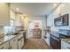 This modern kitchen boasts granite countertops, white subway tile, stainless steel appliances, and backyard access at 2521 Carlisle Pl, Sarasota, FL 34231