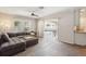 Spacious living room with tile flooring and sliding doors to the pool area at 2521 Carlisle Pl, Sarasota, FL 34231