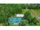 Community amenities include basketball and sand volleyball courts, surrounded by lush trees at 26835 Juniper Bay Dr, Wesley Chapel, FL 33544