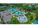 Community features a resort-style pool, splash pad, and amenities surrounded by lush landscaping at 26835 Juniper Bay Dr, Wesley Chapel, FL 33544