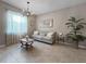 Comfortable living room with stylish furniture, chandelier, and bright natural light at 26835 Juniper Bay Dr, Wesley Chapel, FL 33544