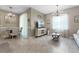 Cozy living room with lots of natural light and modern décor, adjacent to the dining area at 26835 Juniper Bay Dr, Wesley Chapel, FL 33544