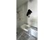 Bathroom with tiled walls, a modern sink, and a toilet at 13725 Plumosa Ave, Hudson, FL 34667