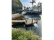 Dock on the canal with a lounge chair and a boat lift at 13725 Plumosa Ave, Hudson, FL 34667