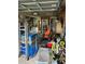 View of the garage filled with various tools, equipment, and storage items at 13725 Plumosa Ave, Hudson, FL 34667