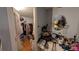 A walk-in closet featuring clothing and storage, with a doorway leading to an adjacent room at 249 Malvern Dr, Venice, FL 34293