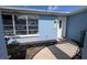 Home exterior with a white front door, a well-kept walkway, and well manicured landscaping at 249 Malvern Dr, Venice, FL 34293