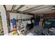Garage with storage, shelving, and various items, offering space for parking and organization at 249 Malvern Dr, Venice, FL 34293