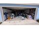 View of open garage with storage and miscellaneous items at 249 Malvern Dr, Venice, FL 34293