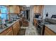 The kitchen features stainless steel appliances and wood cabinetry at 249 Malvern Dr, Venice, FL 34293