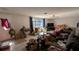 The bright and spacious living room has tile floors and large windows at 249 Malvern Dr, Venice, FL 34293