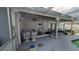 The home has a covered outdoor patio space with room for seating at 249 Malvern Dr, Venice, FL 34293