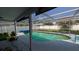 A view of the private screened-in pool with an outdoor lounging area at 249 Malvern Dr, Venice, FL 34293