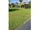 Large backyard with grassy lawn overlooking a canal and a private boat dock at 4713 9Th E St, Ellenton, FL 34222