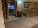 Basement with a sliding glass door for ample natural light, complemented by a plush sectional sofa and accent furniture at 4713 9Th E St, Ellenton, FL 34222