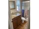 Bathroom featuring updated vanity with granite countertop and tiled walk-in shower at 4713 9Th E St, Ellenton, FL 34222