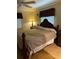 Bedroom with neutral walls and hardwood floors, complemented by natural lighting at 4713 9Th E St, Ellenton, FL 34222