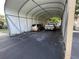 View of a long, covered carport area with space for multiple vehicles and storage at 4713 9Th E St, Ellenton, FL 34222