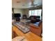 Cozy living room with hardwood floors, decorative rug, and a leather sofa set at 4713 9Th E St, Ellenton, FL 34222