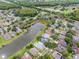 Lakeside aerial view showcasing beautiful homes, mature landscaping, manicured lawns, and community amenities at 9246 Dayflower Dr, Tampa, FL 33647